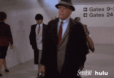Elaine and Jerry running at the airport